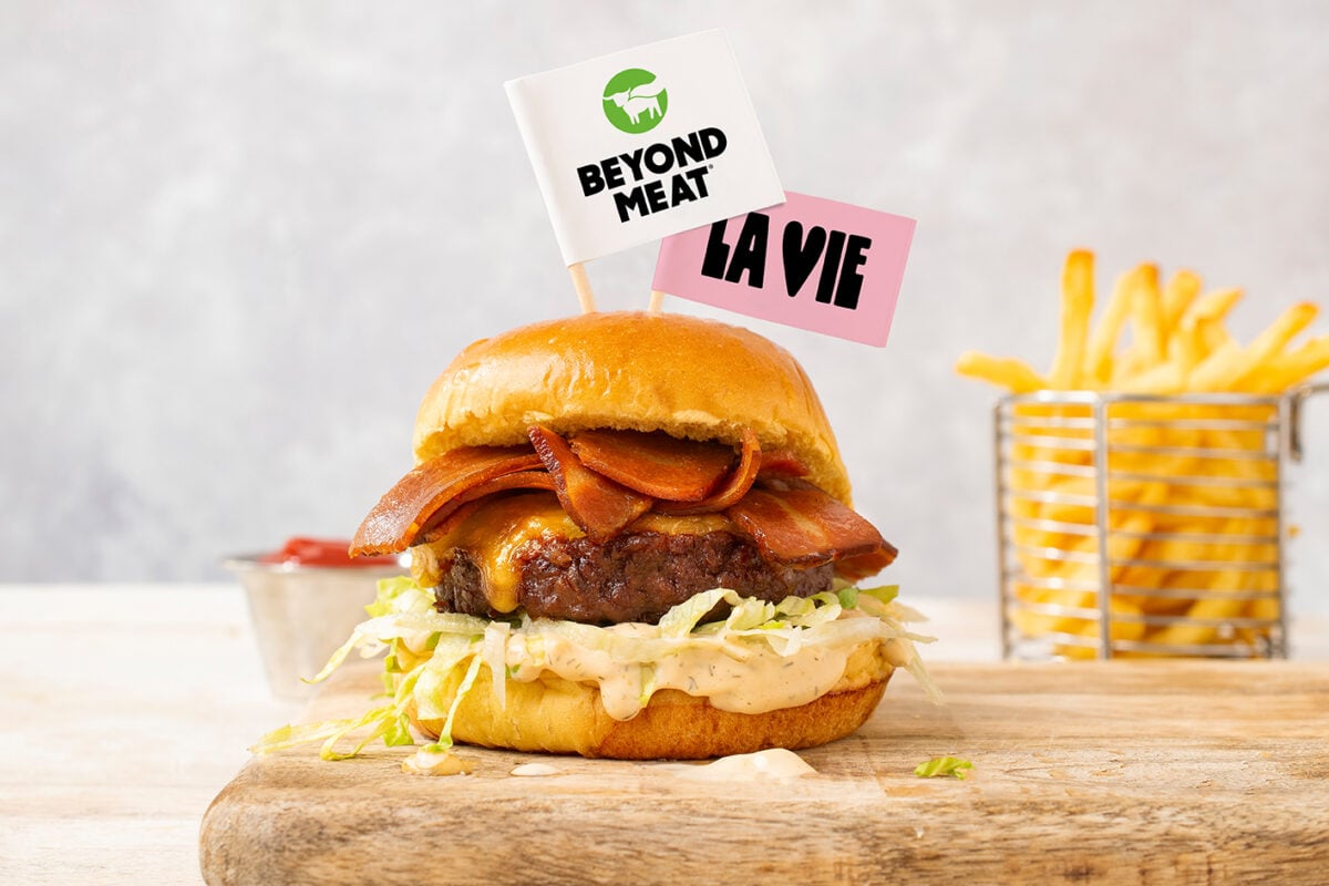Photo shows a bacon burger made with a plant-based Beyond Meat patty and vegan La Vie rashers