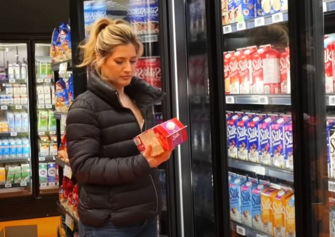 Plant-based YouTuber Candice Hutchings in a still from a video on vegan budget grocery shopping