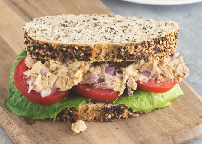 Caesar smashed chickpea sandwiches with tomato and lettuce
