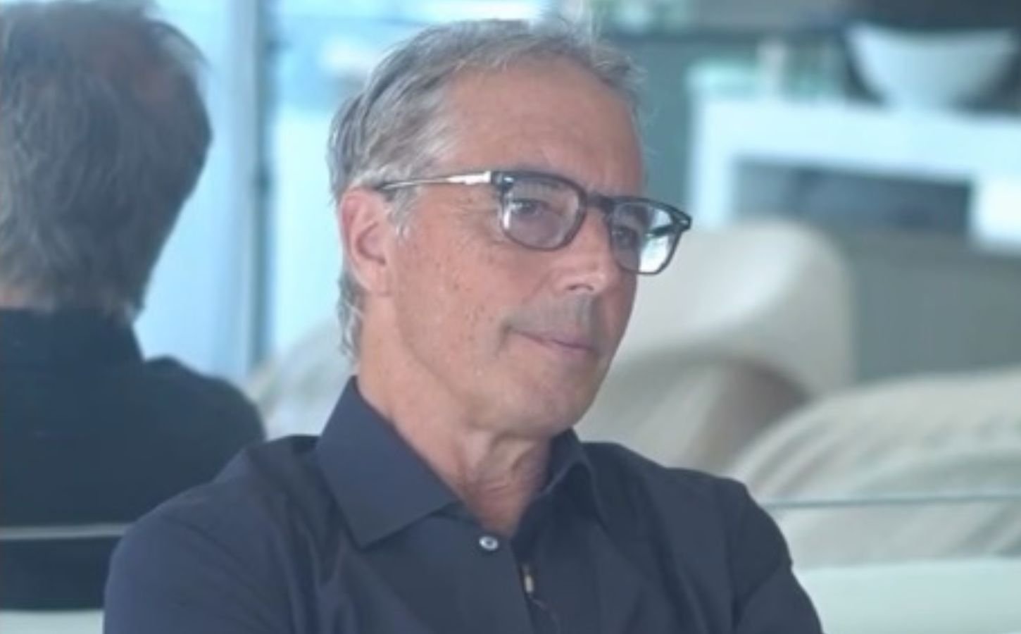 The image is a screengrab of Dan Buettner as he talks about the importance of complex carbohydrates