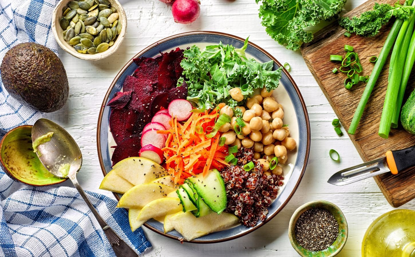 Photo shows a colorful bowl of fresh fruit, vegetables, and salad