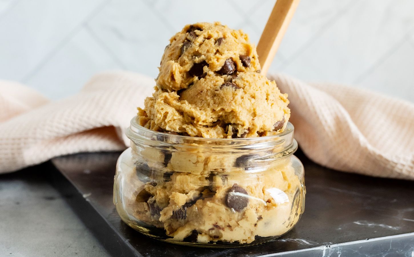 a jar of edible cookie dough made of chickpeas