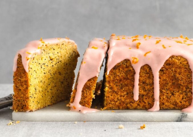 gluten-free poppy seed tea cake with raspberry cream cheese icing
