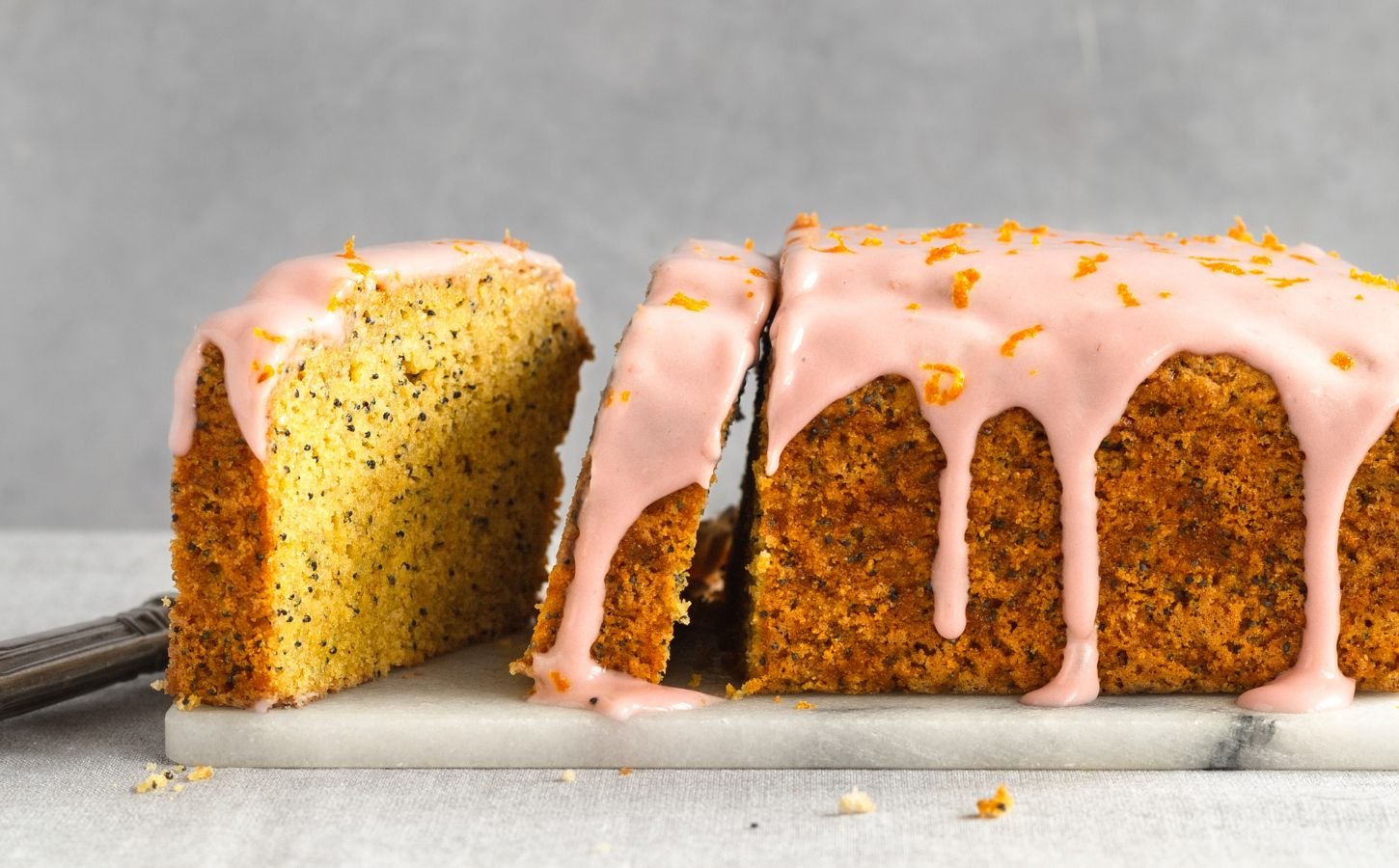 gluten-free poppy seed tea cake with raspberry cream cheese icing