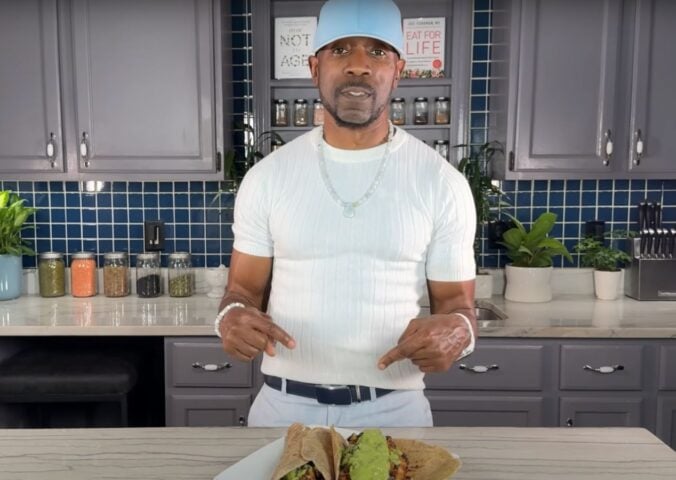 Plant-based YouTuber Javant B in a still from a video showcasing his wfpb healthy burrito recipe