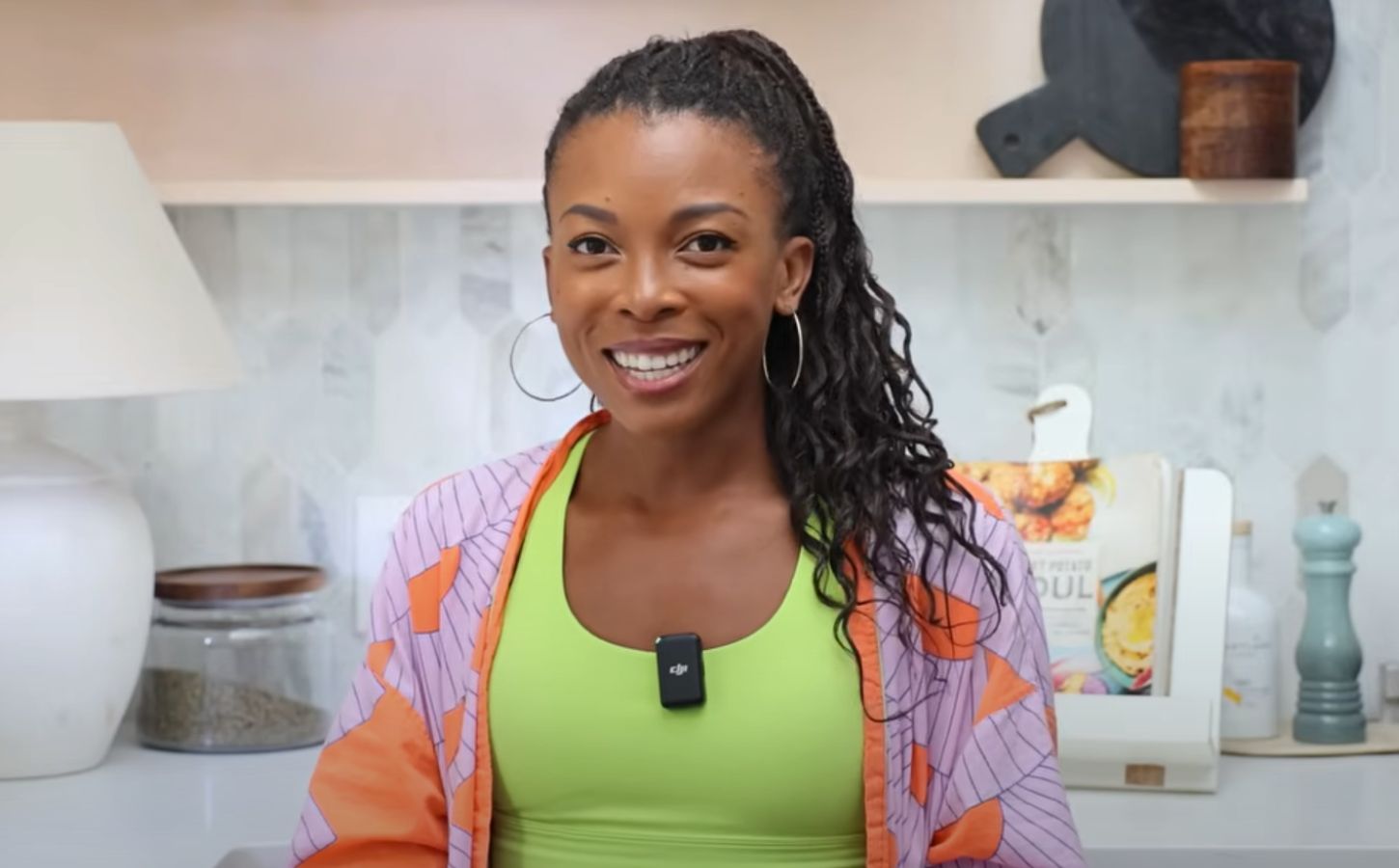 A still of Jenné Claiborne from Sweet Potato Soul YouTube video, showcasing her favorite iron-rich vegan foods