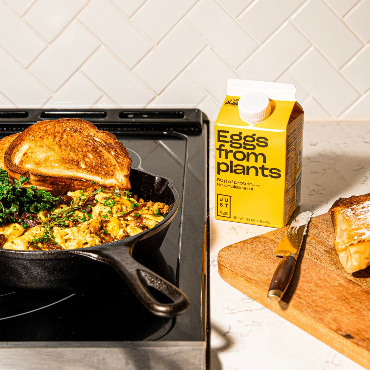 A packet of JUST Egg next to some vegan scrambled egg
