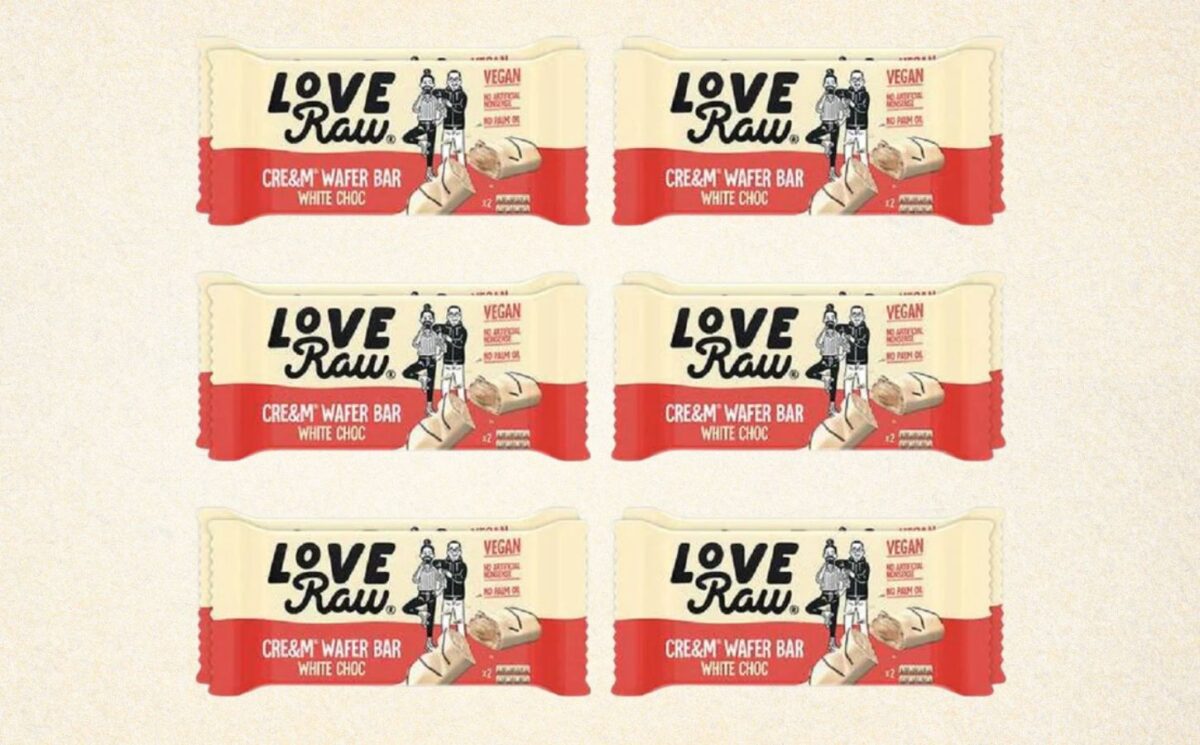 A selection of vegan white chocolate bars from plant-based chocolate brand LoveRaw in front of a cream background