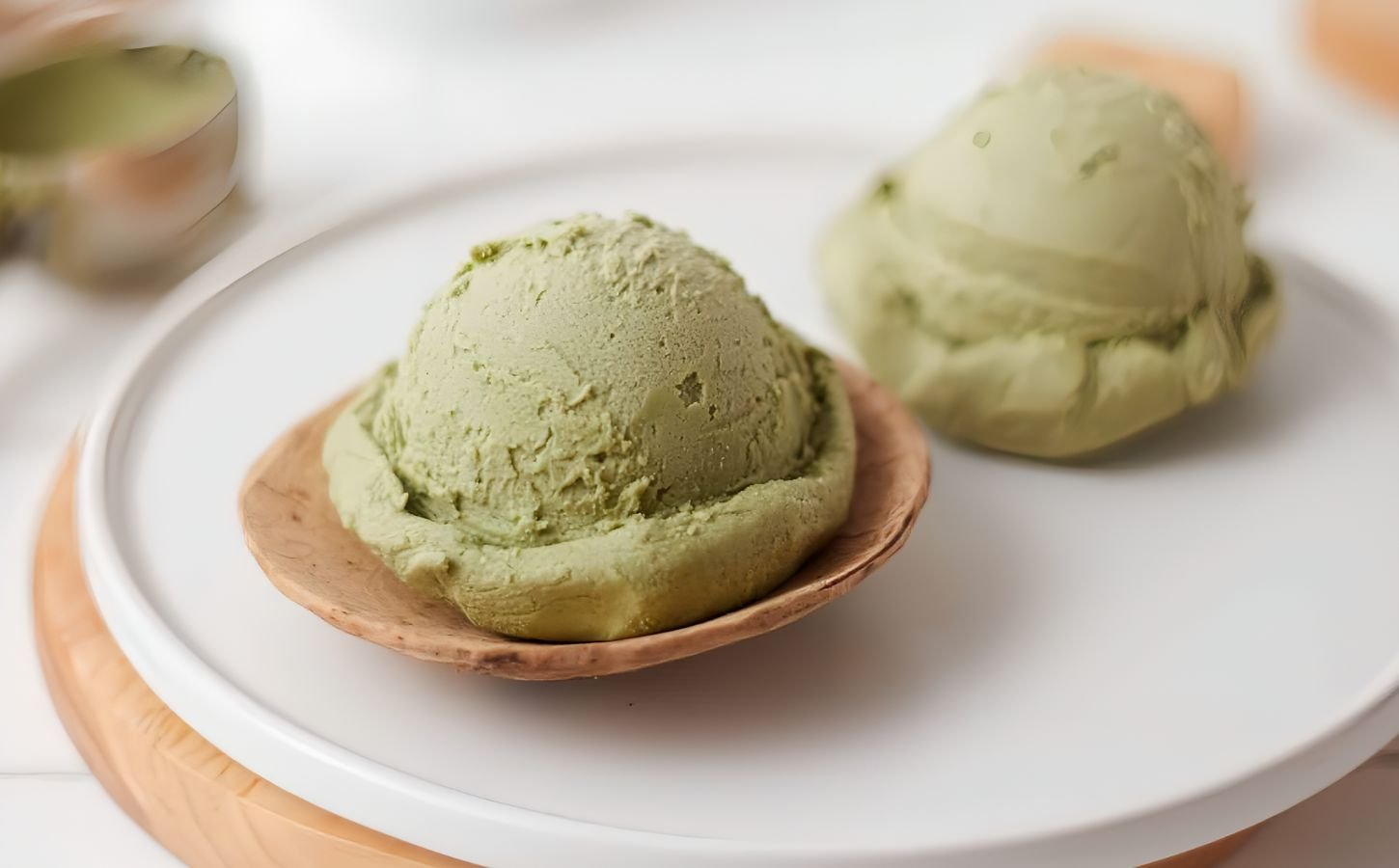 scoops of matcha nice cream with banana and matcha powder