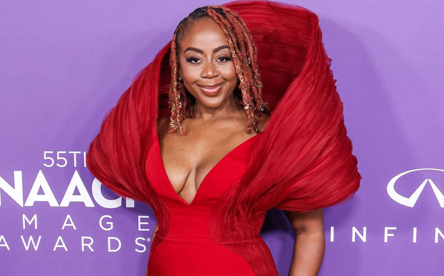Slutty Vegan founder Pinky Cole Hayes on the red carpet in a red dress