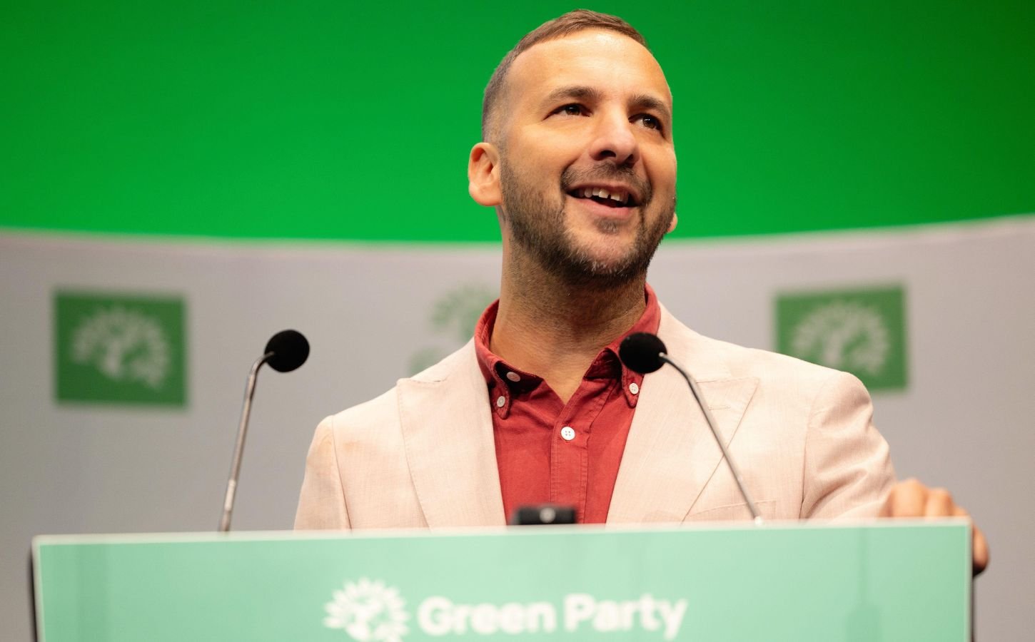 Photo shows Zack Polanski, the deputy leader of the Green Party, at a speaking event