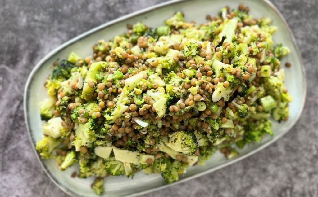 Lentil and broccoli vegan summer salad served on a rectangular platter