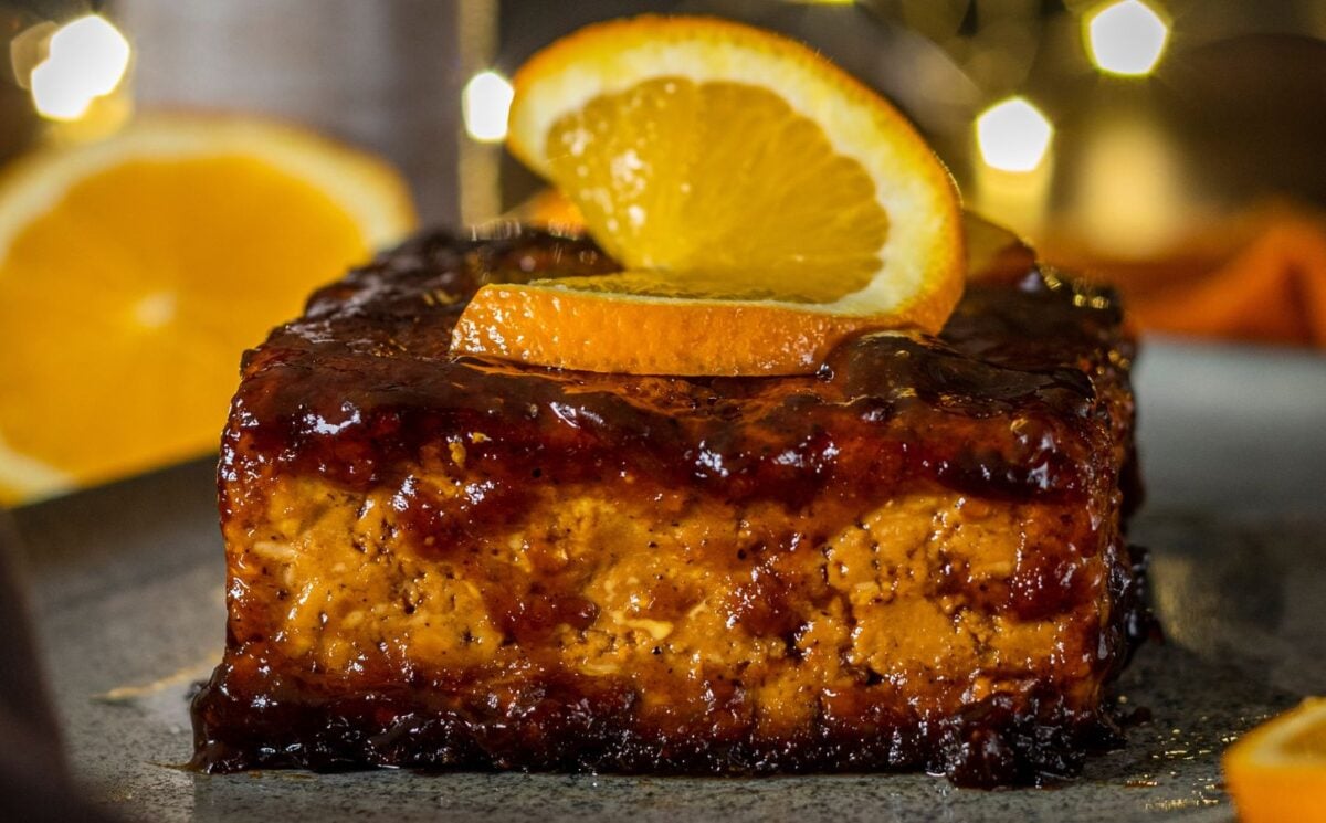 Orange and ginger glazed tofu with a slice of orange on top