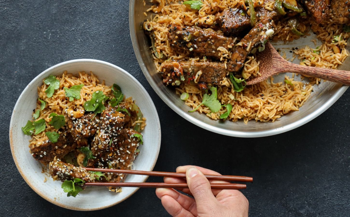 teriyaki glazed tempeh strips cooked with soy, garlic, and sesame over rice