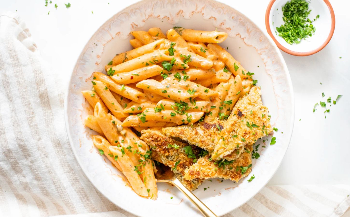 Vegan pasta with panko Cajun tempeh and dairy-free cheese