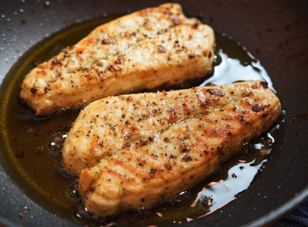 Photo shows two fillets of the latest Revo Foods product, vegan black cod, in a frying pan