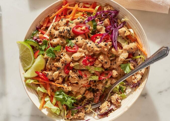 satay chickpea and quinoa salad with veggies and lime
