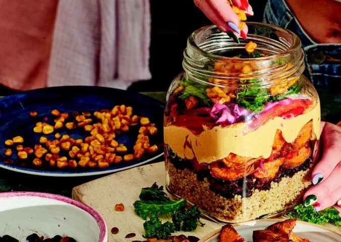 sweet potato rainbow salad with quinoa, corn. and cabbage