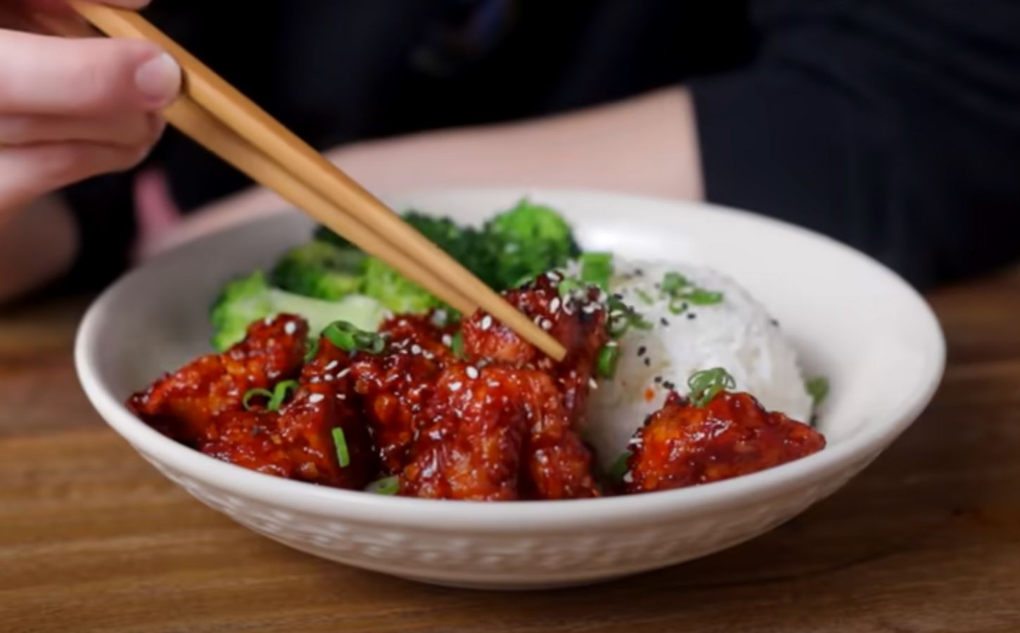 A bowl of gochujang tofu from a video on tofu recipes