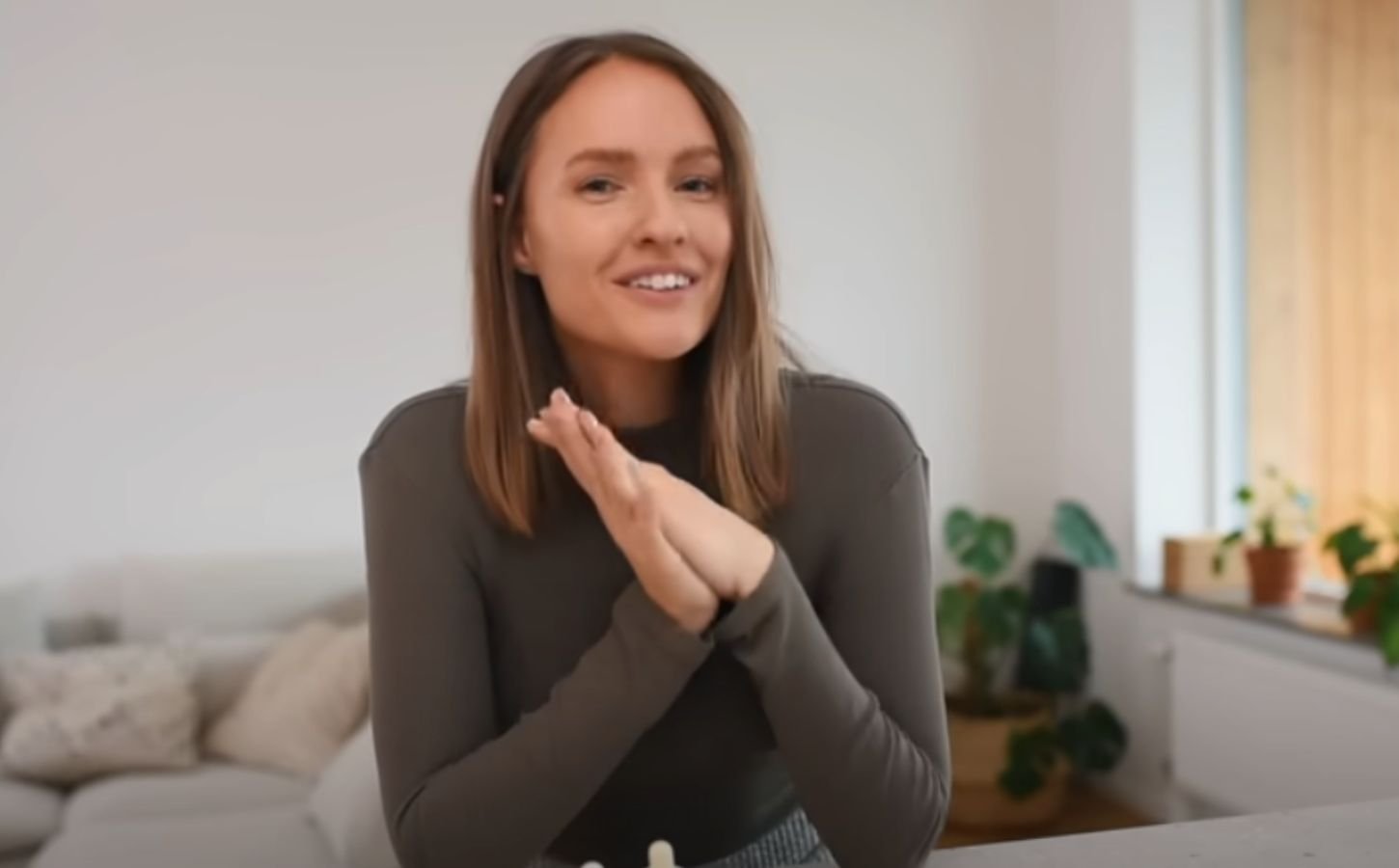 Vegan content creator Alexandra Andersson in a still from a video on whole food, plant-based recipes